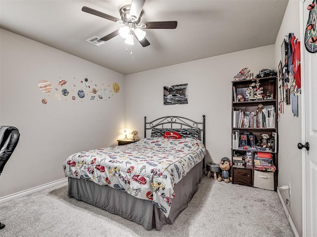 carpeted bedroom with ceiling fan, baseboards, and visible vents