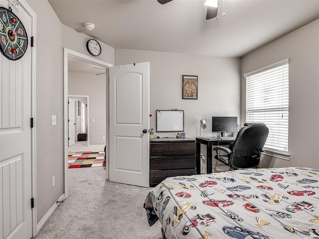 carpeted bedroom with ceiling fan