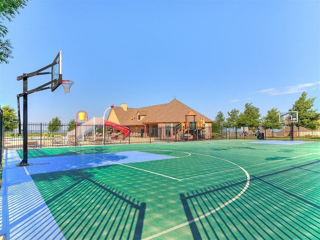 view of basketball court featuring fence and community basketball court