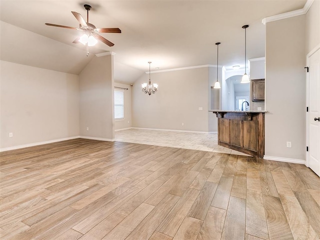 18232 Scarborough Dr, Edmond, OK 73012 - unfurnished living room featuring light wood-style flooring, a ceiling fan, ornamental molding, a chandelier, and lofted ceiling