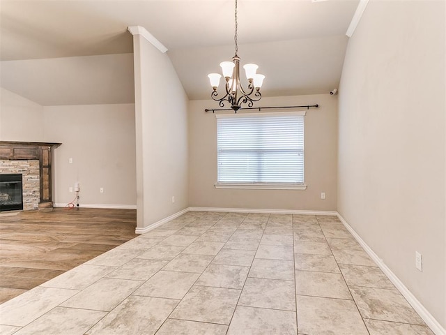 18232 Scarborough Dr, Edmond, OK 73012 - unfurnished dining area featuring vaulted ceiling, a chandelier, and a stone fireplace
