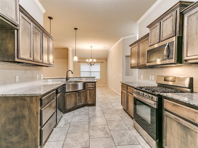 18232 Scarborough Dr, Edmond, OK 73012 - kitchen with appliances with stainless steel finishes, tasteful backsplash, light stone counters, ornamental molding, and a chandelier