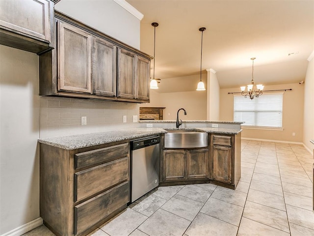 18232 Scarborough Dr, Edmond, OK 73012 - kitchen with stainless steel dishwasher, tasteful backsplash, a peninsula, and light stone countertops