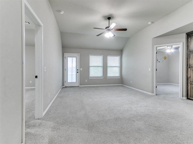 18232 Scarborough Dr, Edmond, OK 73012 - unfurnished living room featuring a ceiling fan, carpet flooring, and lofted ceiling