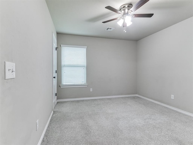18232 Scarborough Dr, Edmond, OK 73012 - spare room with ceiling fan and carpet