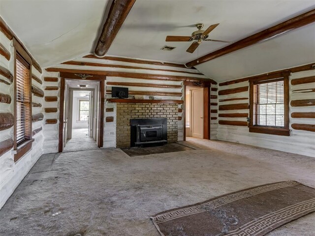 unfurnished living room with a ceiling fan, lofted ceiling with beams, carpet, and visible vents