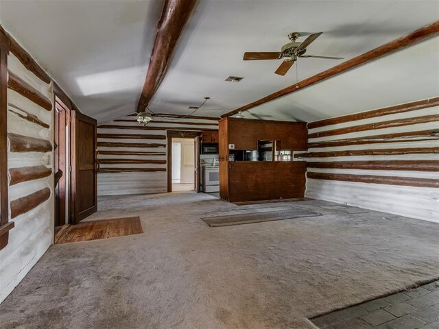 interior space with ceiling fan, lofted ceiling with beams, carpet floors, wood walls, and visible vents