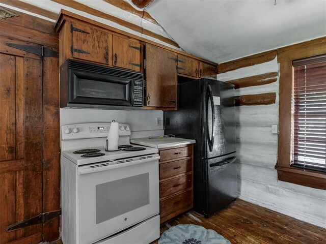 kitchen featuring brown cabinets, light countertops, black appliances, lofted ceiling, and dark wood-type flooring