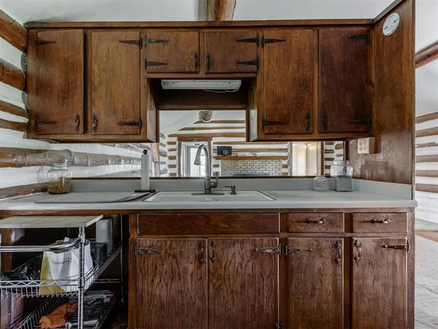 kitchen with light countertops and a sink
