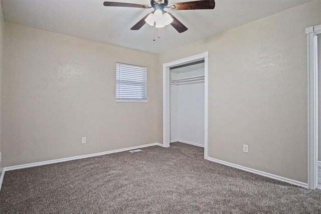 unfurnished bedroom with ceiling fan, carpet floors, a closet, and baseboards