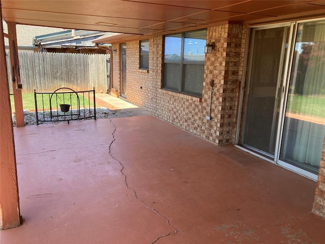 view of patio featuring fence