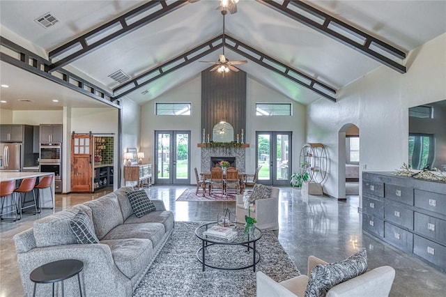 25478 Sooner Ave, Purcell, OK 73080 - living room with high vaulted ceiling, french doors, arched walkways, and a ceiling fan