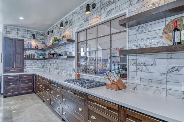 25478 Sooner Ave, Purcell, OK 73080 - bar area featuring stainless steel gas cooktop, concrete flooring, and decorative backsplash
