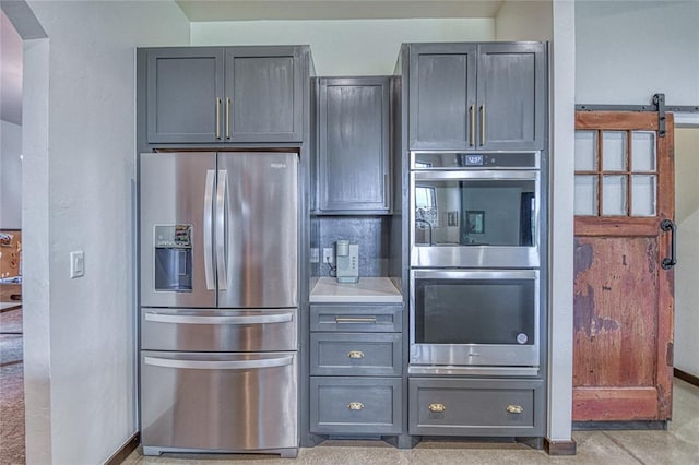 25478 Sooner Ave, Purcell, OK 73080 - kitchen featuring stainless steel appliances, gray cabinetry, and light countertops