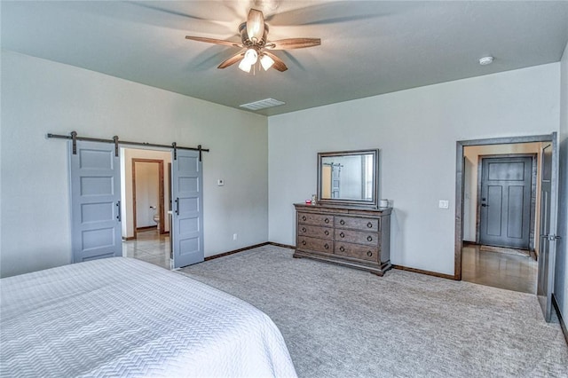 25478 Sooner Ave, Purcell, OK 73080 - bedroom featuring carpet flooring, a barn door, and ceiling fan