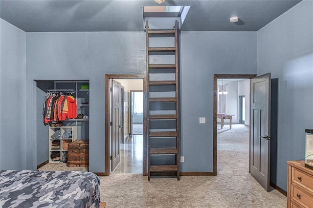 25478 Sooner Ave, Purcell, OK 73080 - bedroom with light carpet, a walk in closet, and a closet