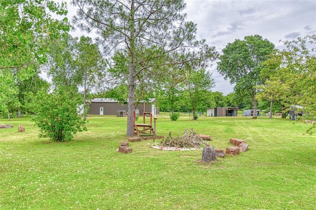 25478 Sooner Ave, Purcell, OK 73080 - view of green lawn with view of wooded area