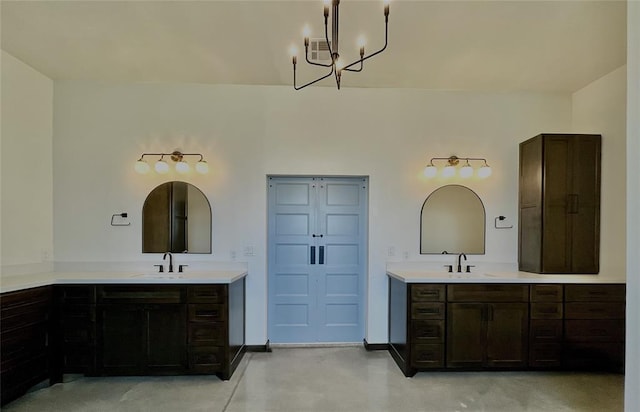 25478 Sooner Ave, Purcell, OK 73080 - full bathroom with concrete flooring, two vanities, and a chandelier
