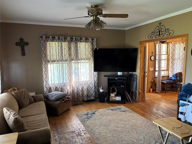 27582 N 2840th Rd, Okarche, OK 73762 - living area featuring plenty of natural light, a ceiling fan, wood finished floors, and crown molding