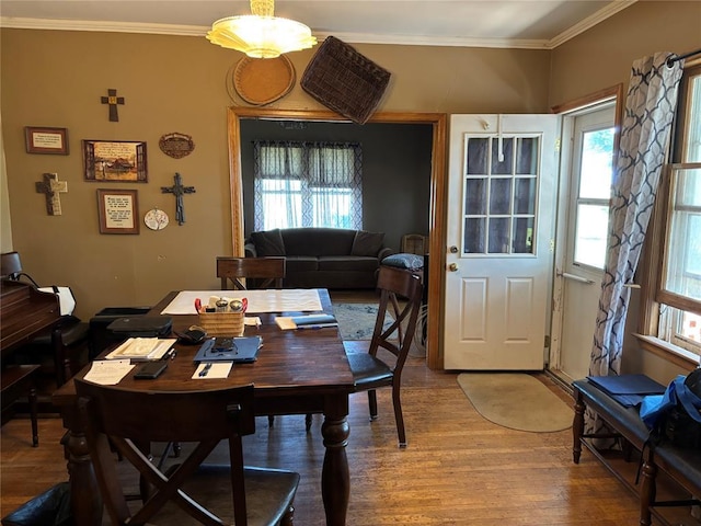 27582 N 2840th Rd, Okarche, OK 73762 - dining area featuring wood finished floors, crown molding, and plenty of natural light