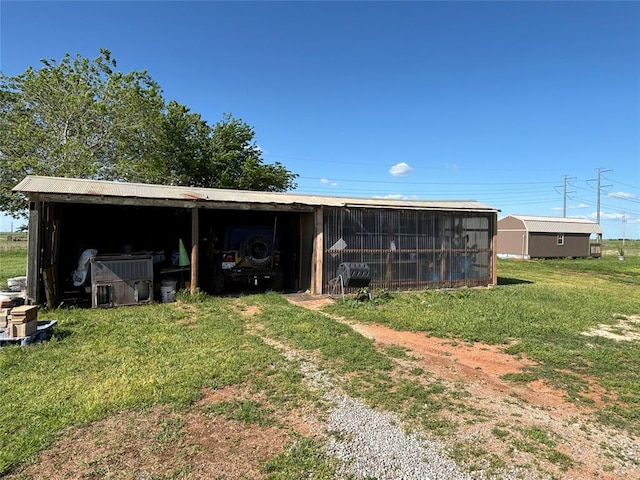 27582 N 2840th Rd, Okarche, OK 73762 - view of pole building featuring a yard and a carport