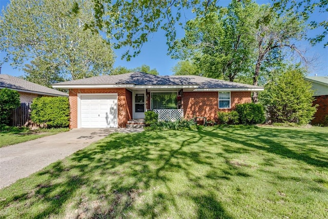 10 Burk Way, Del City, OK 73115 - ranch-style home with a front lawn, driveway, fence, a garage, and brick siding