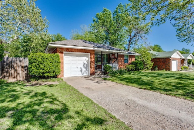 10 Burk Way, Del City, OK 73115 - ranch-style house with fence, a front lawn, an attached garage, driveway, and brick siding