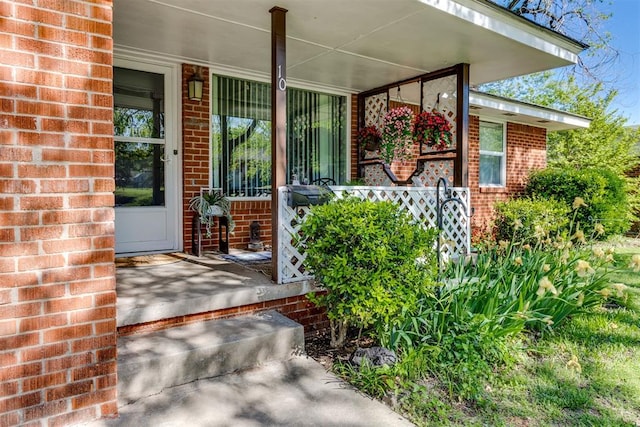 10 Burk Way, Del City, OK 73115 - view of exterior entry featuring brick siding and a porch