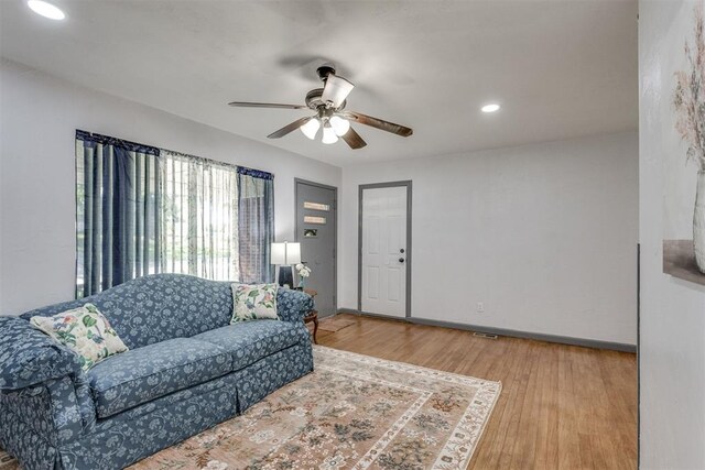 10 Burk Way, Del City, OK 73115 - living area with baseboards, a ceiling fan, wood finished floors, and recessed lighting