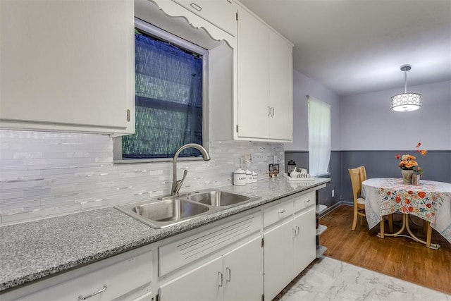 10 Burk Way, Del City, OK 73115 - kitchen with tasteful backsplash, a sink, marble finish floor, light countertops, and white cabinets