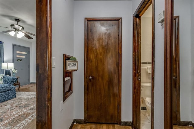 10 Burk Way, Del City, OK 73115 - corridor featuring baseboards and wood finished floors