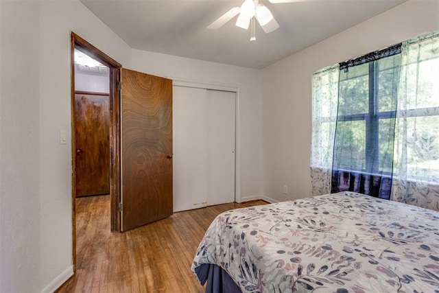 10 Burk Way, Del City, OK 73115 - bedroom with ceiling fan, baseboards, wood finished floors, and a closet