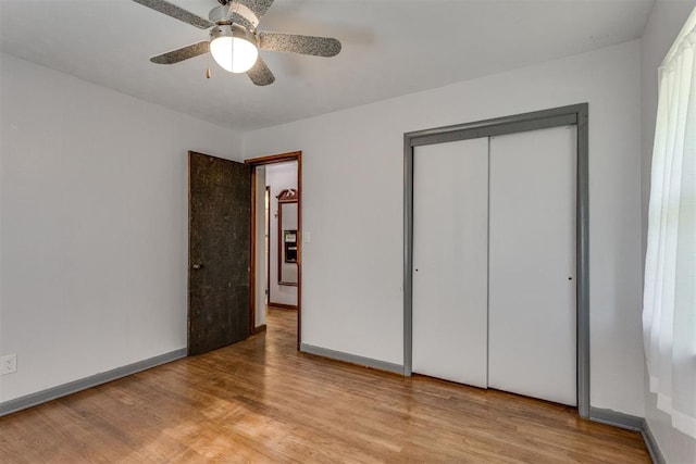 10 Burk Way, Del City, OK 73115 - unfurnished bedroom with ceiling fan, baseboards, wood finished floors, and a closet