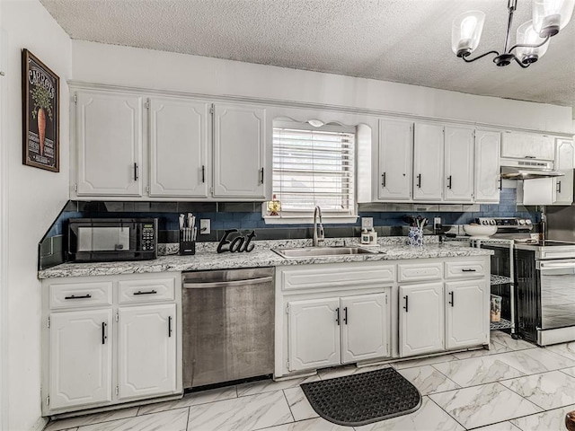 2909 Wheeler Ct, Oklahoma City, OK 73127 - kitchen featuring marble finish floor, white cabinets, appliances with stainless steel finishes, and a sink