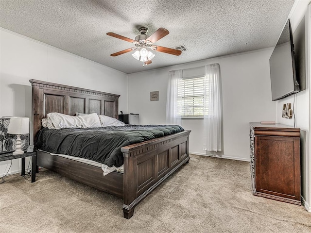 2909 Wheeler Ct, Oklahoma City, OK 73127 - bedroom with ceiling fan, visible vents, a textured ceiling, and light colored carpet
