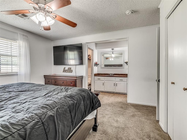 2909 Wheeler Ct, Oklahoma City, OK 73127 - bedroom with a textured ceiling, a ceiling fan, light carpet, and visible vents