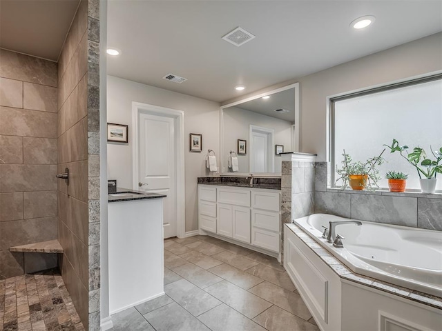 bathroom with visible vents, a tile shower, a tub with jets, vanity, and recessed lighting