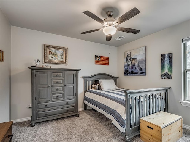 bedroom featuring carpet floors, a ceiling fan, baseboards, and visible vents
