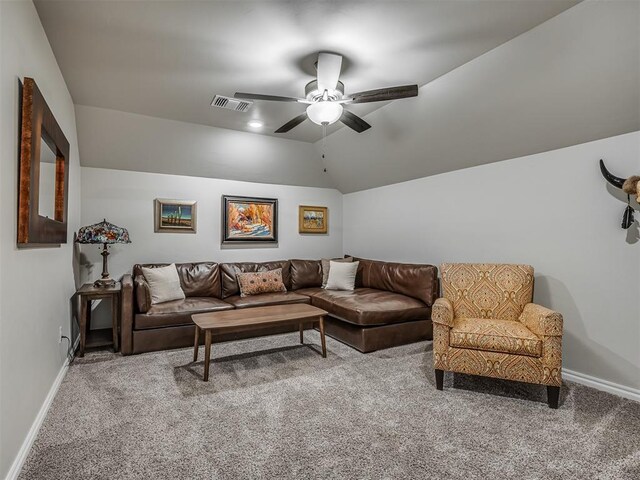 carpeted living room featuring baseboards, ceiling fan, vaulted ceiling, and visible vents