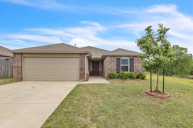 single story home featuring brick siding, roof with shingles, a front lawn, concrete driveway, and an attached garage
