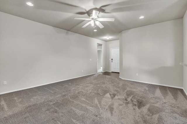 carpeted spare room with a ceiling fan, recessed lighting, and baseboards