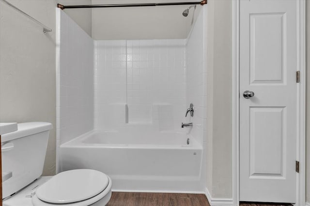 full bathroom featuring toilet, shower / bathtub combination, and wood finished floors