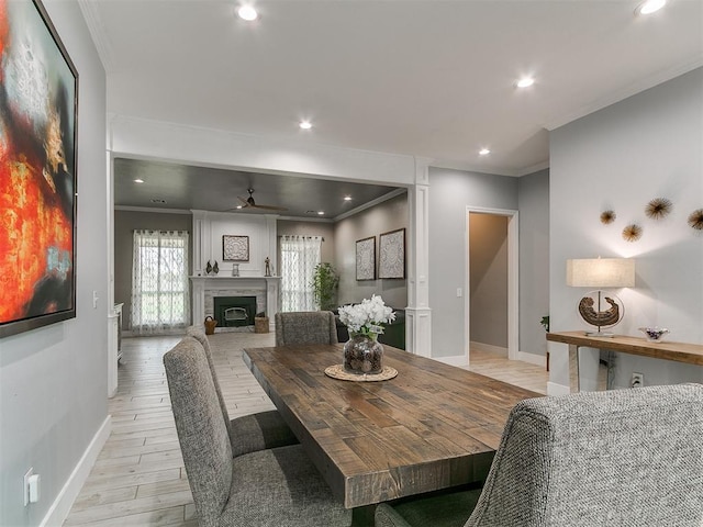 dining room with a ceiling fan, baseboards, recessed lighting, and ornamental molding