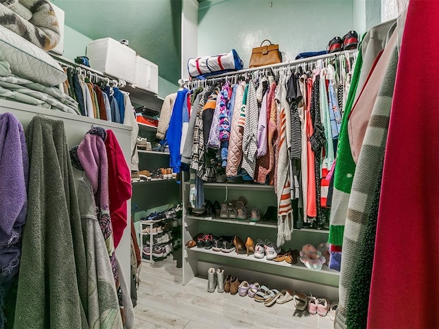 spacious closet featuring wood finished floors
