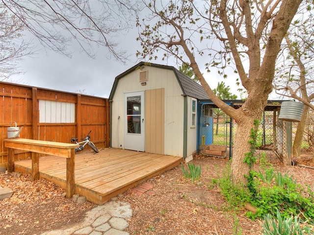 view of shed featuring a gate and a fenced backyard