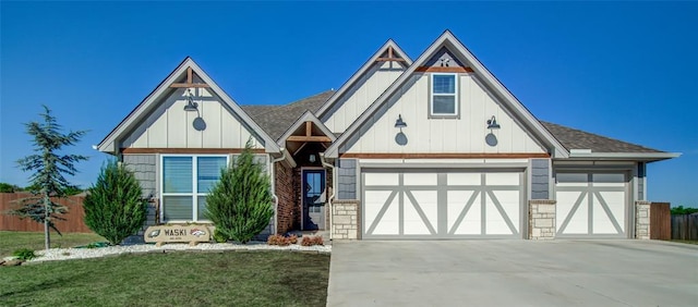 4145 Thunderhead Rd, Norman, OK 73072 - tudor home with concrete driveway, an attached garage, board and batten siding, and a shingled roof