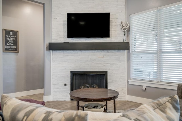 4145 Thunderhead Rd, Norman, OK 73072 - living area with wood finished floors and a stone fireplace