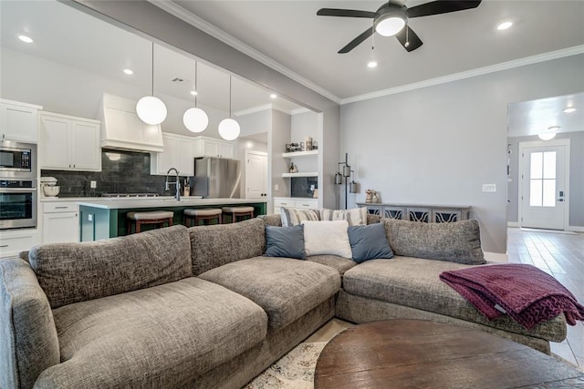 4145 Thunderhead Rd, Norman, OK 73072 - living room with a ceiling fan, crown molding, and recessed lighting