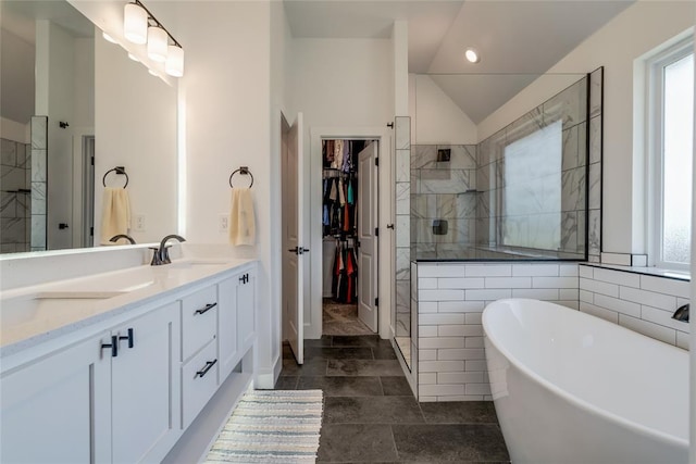 4145 Thunderhead Rd, Norman, OK 73072 - bathroom with double vanity, tiled shower, a soaking tub, a spacious closet, and vaulted ceiling