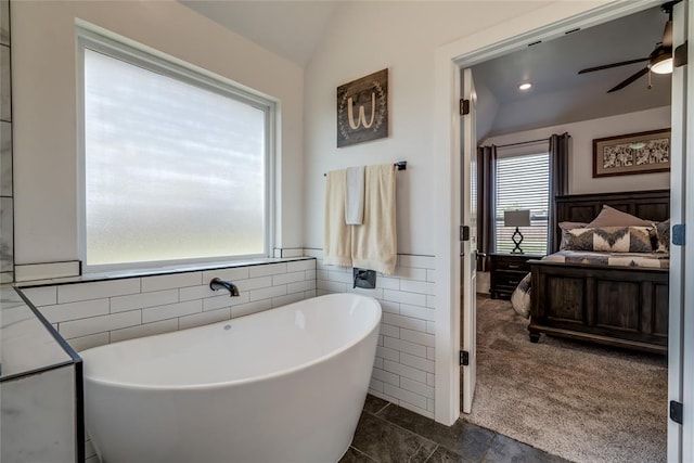 4145 Thunderhead Rd, Norman, OK 73072 - bathroom featuring a freestanding tub, ceiling fan, and lofted ceiling